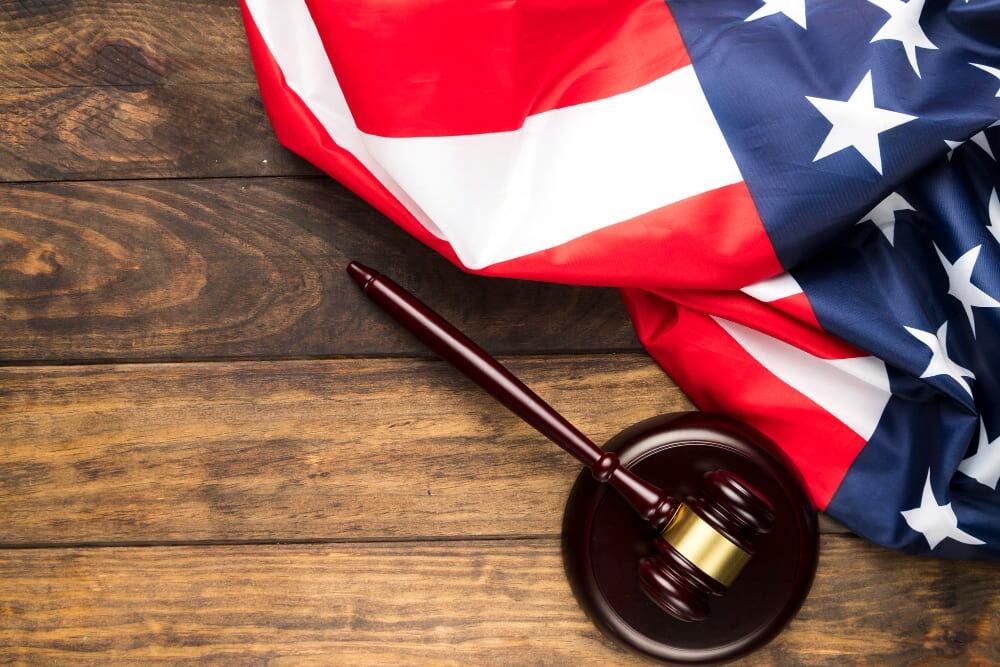 gavel-and-usa-flag Gavel and USA flag on wooden table