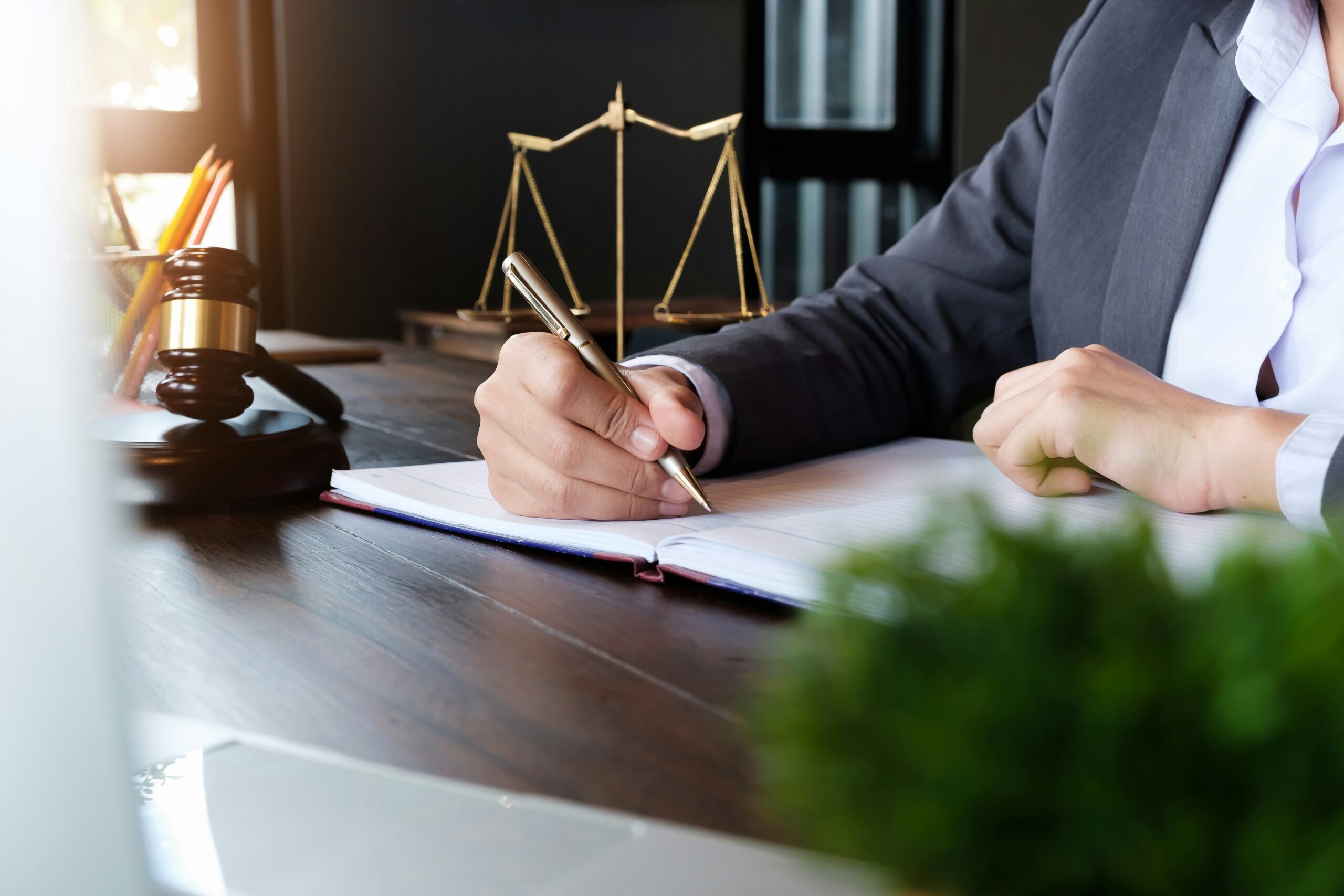 Personal injury lawyer in a suit writing case notes