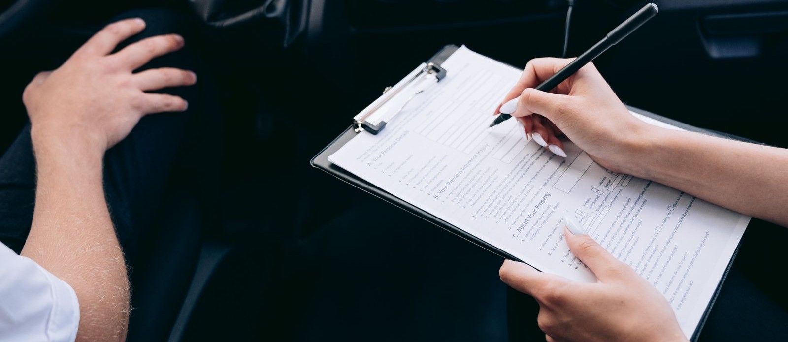 Filling out an insurance claim form after a Florida car accident